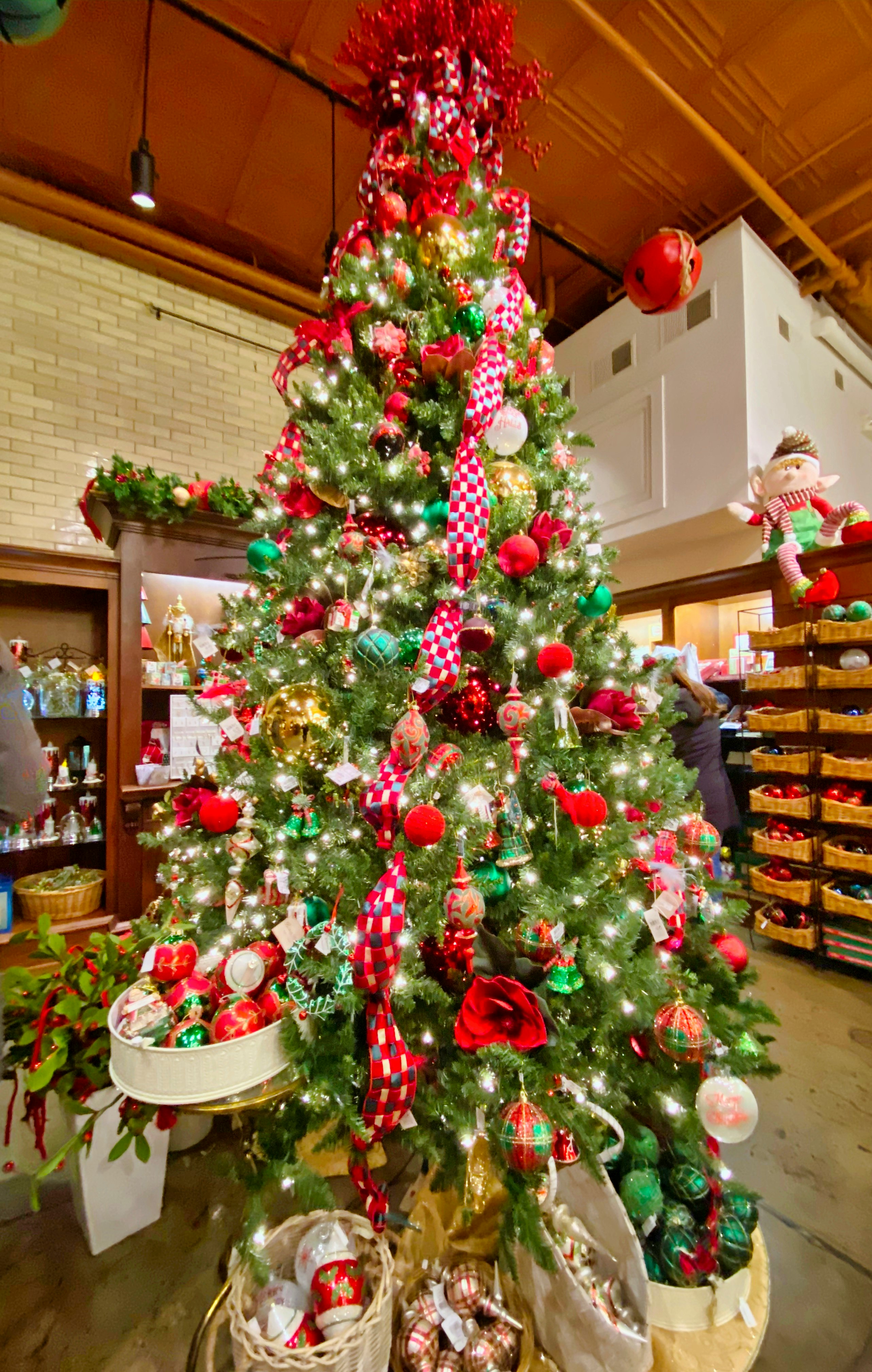 green and red christmas tree with baubles